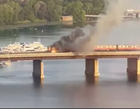 WATCH: Train catches fire on Boston river bridge, passengers jump out of the windows to escape flames