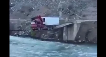 Stunning Video:  Dare devil truck driver crosses precariously hanging narrow bridge